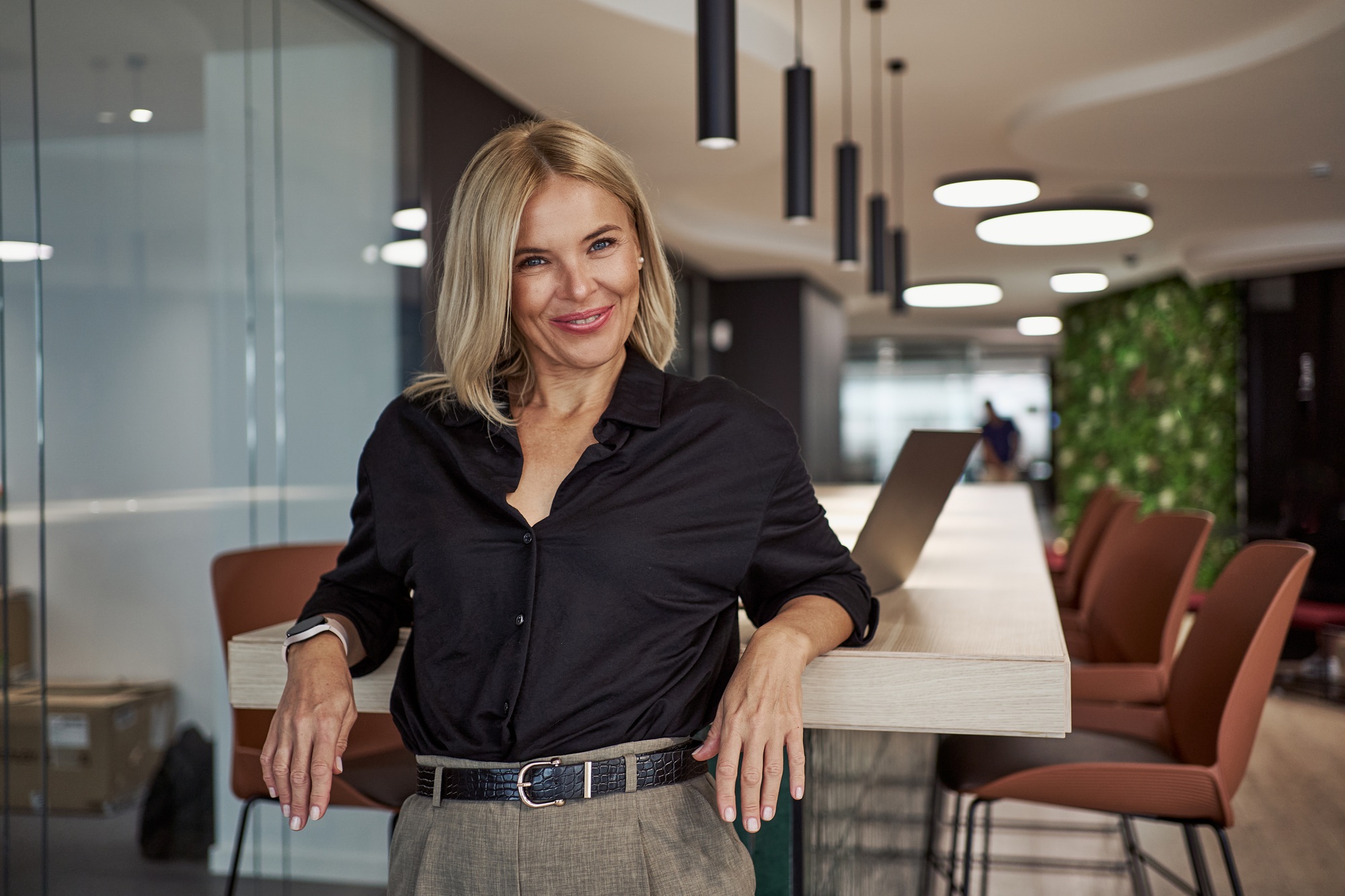 A Professional Woman Thrives in a Modern Office, Emphasizing Design and Practicality